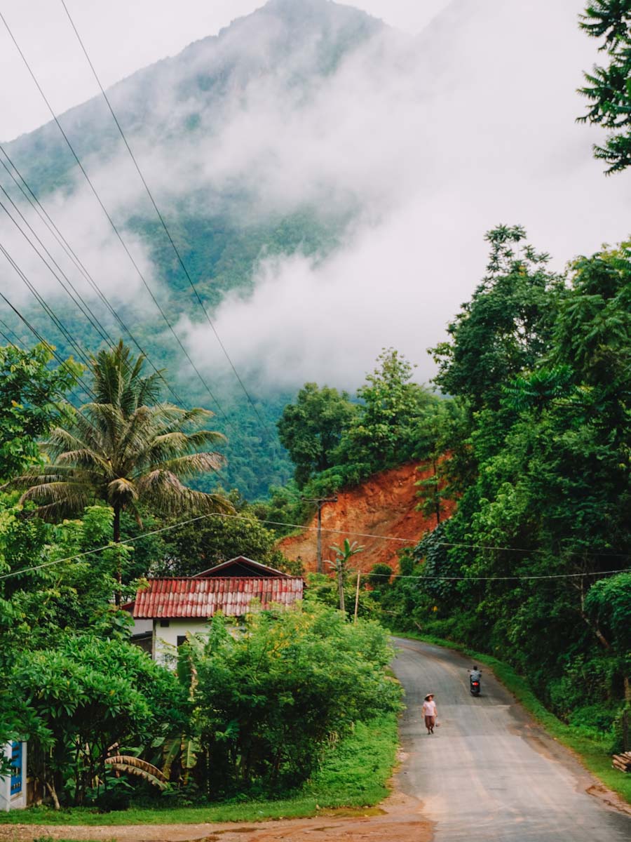 Nong Khiaw street with mountains in the mist