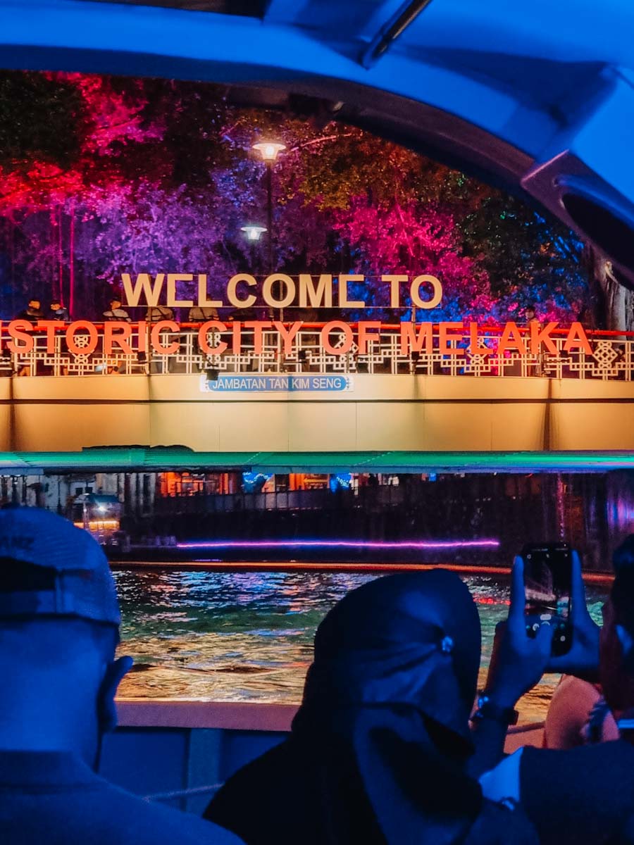 River cruise at night through the city of Malacca, Malaysia