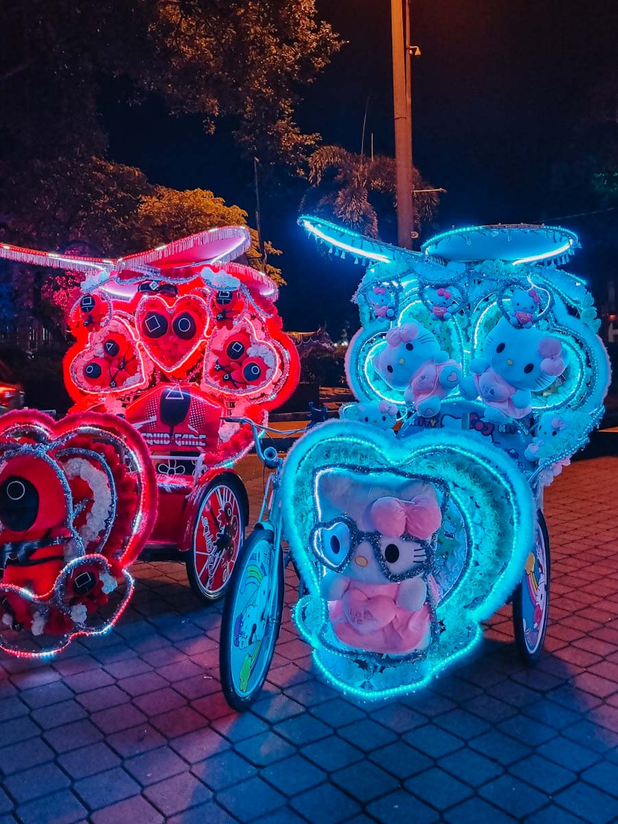 Traditional trishaws in Malacca, Malaysia lighting up at night