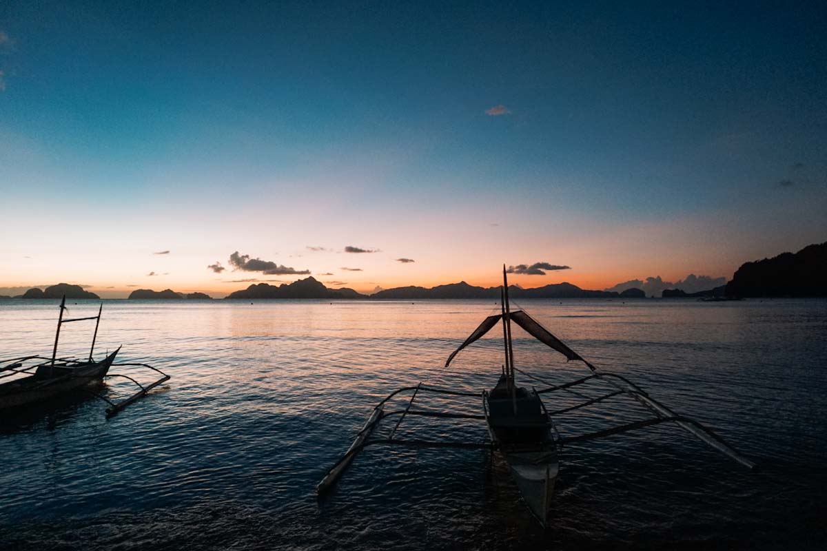 Sunset from Corong Corong beach with Filipino boats