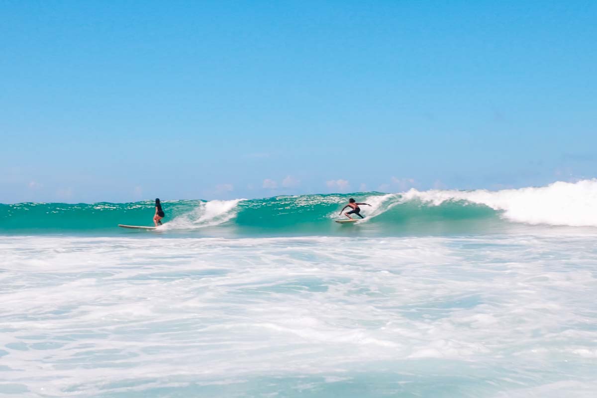 People surfing at Duli Beach, Palawan